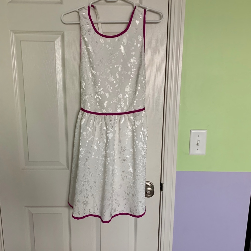 White dress with purple piping